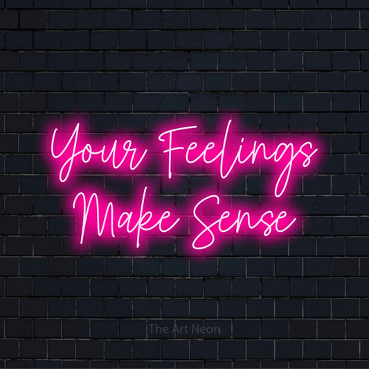 "Your Feelings Make Sense" text design with neon effect on a black brick wall